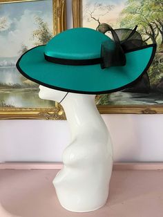 "Classic vintage hat. Perfect for Ascot, weddings, special occasions, very elegant. Comes with elastic to hold hat in place. Condition: vintage perfect Colour: teal Label: Made in England Material: polyester Size: M inner circumference aprox. 21.5-22 inches, circumference 44\"\" *Please note all hats come securely packed in a box *All our vintage items come in clean and best condition possible *Please note all hats come securely packed in a box *All our vintage items are top quality authentic vi Fitted Green Fedora For Kentucky Derby, Fitted Wide Brim Costume Hats And Headpieces For Evening, Fitted Wide Brim Costume Hat For Evening, Fitted Evening Costume Hat With Wide Brim, Fitted Felt Hat For Formal Summer Events, Elegant Fedora For Church, Elegant Fedora Mini Hat For Church, Formal Wide Brim Fitted Fascinator, Fitted Boater Hat With Short Brim For Evening