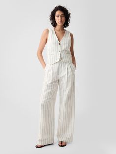 Soft linen-cotton blend trousers.  E-waist with concealed hook and bar closure, zip fly.  Front slant pockets, back welt pockets.  Certain styles have allover prints.  * Fit: Classic.  An easy silhouette that fits close  at the waist, and is relaxed through the hips and thigh.  Note: Mette Linturi is wearing a Gap Classic Summer Outfits, Cotton Linen Trousers, Miami Outfits, Linen Clothing, Cotton Vest, Straight Leg Trousers, Linen Women, Linen Clothes, Striped Linen