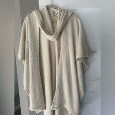 This Off-White Women’s Wrap/Poncho Style Sweater Will Be Cute To Add To Your Wardrobe. White Oversized Casual Poncho, Casual White Poncho With Batwing Sleeves, Casual White Cotton Poncho, Casual Oversized Cream Poncho, Cream Casual Poncho, One Size Fits All, Cream Casual Poncho One Size, Oversized White Poncho Cape, Oversized White Cape Poncho, Cozy Oversized White Poncho