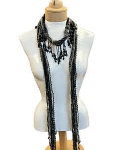 These beaded scarf necklaces are made with Italian silk yarns, Mohair and other yarns. A great accent for your holiday wardrobe. They are lightweight and comfortable to wear. Measuring 48 inches in length. A mix of black, white, and gray, with accents of beads. Comes in a linen gift pouch. Bohemian Black Handwoven Beaded Necklaces, Bohemian Black Handmade Scarves, Bohemian Black Handmade Scarf, Handmade Black Scarves As Gifts, Scarf Necklaces, Beaded Scarf, Mohair Scarf, Scarf Yarn, Scarf Necklace