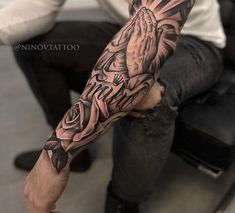 a man with a tattoo on his arm