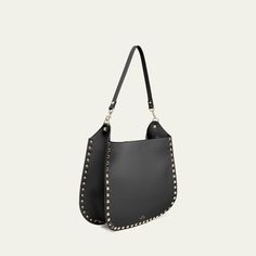 Valentino Garavani hobo bag in calfskin leather with Rockstud trim  Detachable shoulder strap  Detachable, adjustable crossbody strap Can be worn as a shoulder or crossbody bag  Open top with lift-clasp closure  Approx. 10.2"H x 7.9"W x 3.9"D Made in Italy Luxury Hobo Shoulder Bag With Gunmetal Hardware, Crossbody Hobo Bag With Gunmetal Hardware For Evening, Gunmetal Hardware Crossbody Hobo Bag For Evening, Luxury Crossbody Hobo Bag With Gunmetal Hardware, Luxury Hobo Bag With Gunmetal Hardware Crossbody, Hobo Bag, Valentino Garavani, Calf Skin, Crossbody Bag