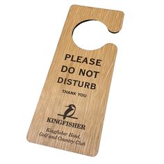 a wooden bottle opener with a sign saying please do not disturb thank you kingfisher golf and country club