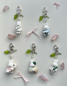 several charms are arranged in the shape of animals