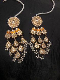 Always desire to look fabulous and be the center of attraction! These lightweight and stylish thappa kundan and touch of Meena color long earrings are perfect to make your style sparkle🤩 Book your order now for your upcoming special event Made to order in 3-4 weeks.... Note :Color, shades, texture displayed may slightly vary from the actual product due to digital image limitations. We request you to consider these minor variations. Please expect the possibility of some slight imperfections when Pakistani Earrings, Earrings Kundan, Jewelry Pakistani, Kundan Jewelry, Pakistani Jewelry, Kundan Earrings, Indian Earrings, Jewelry Indian, Kundan Jewellery