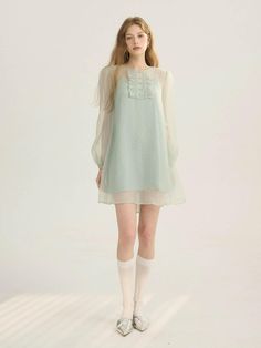 This product is a graceful sheer mini dress, designed to impart an air of ethereal beauty. It features delicate details that imbue it with a soft, romantic character, perfect for creating a subtle yet enchanting presence. With its translucent overlay and intricate bodice, this piece evokes a dreamy, almost fairytale-like quality. - This sheer mini dress captivates with its gossamer sleeves and floaty silhouette, offering an aura of delicate charm- The bodice is adorned with ornate embellishments that add a touch of elegance and fine craftsmanship- Its lightweight fabric ensures a comfortable and breezy wear, ideal for special occasions or as a standout daywear piece- A handmade Cali medal decoration is thoughtfully placed to enhance the dress with an exclusive accent Sheer Mini Dress, Lit Outfits, Future Clothes, Couture Details, Overlay Dress, Ethereal Beauty, Sheer Dress, Character Outfits, Fashion Poses