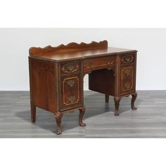 an antique wooden desk with two drawers on one side and a drawer on the other