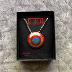 the captain america necklace is in its box