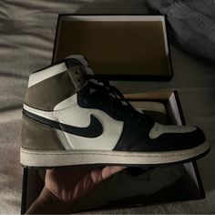 Brand New With The Box Mocha Browns Jordan 1’s High Nike Custom Leather Sneakers With Perforated Toe Box, Nike Leather Sneakers With Perforated Toe Box, Nike Jordan Leather Shoes With Contrast Sole, Nike Jordan Leather Shoes With Rubber Sole, Brown Jordan 1, Nike Brown, Mocha Brown, Shoes Brand, Men's Nike