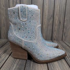 Very G Kady Womens Silver Pearl Rhinestone Heeled Cowgirl Ankle Boot Sz 6.5. Perfect Wedding Boots!!! New In Box. Rhinestone Sparkle Throughout. ** I Do My Very Best To Describe Any Flaws In My Listings & Take The Best Photos Possible. However, Pre-Owned Items May Contains Flaws That Are Not Completely Visible In The Pictures Or Are Unknown At The Time Of Listing. There May Also Been Additional Flaws That Are Unable To Be Pictured. Be Sure To Review All The Photos Closely And Contact Me, Prior T Silver Embellished Wedding Boots, Embellished Silver Wedding Boots, Blue Rhinestone Boots With Pointed Toe, Blue Rhinestone Pointed Toe Boots, Blue Pointed Toe Boots With Rhinestones, Glamorous Blue Rhinestone Boots, Blue High Heel Boots With Rhinestones, Sparkling Round Toe Wedding Boots, Blue Party Boots With Rhinestones