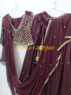 This bollywood style lehanga is made in silk fabric which is high in quality  Blouse is having handwork of sequins on sleeves ,in front,and big patch of work at the back Dupatta in georgette with lace border.lace is also made by handembridoidry. It can be customize in any size But extra charges for xl sizes We use high quality fabric at craversvogue After you purchase the dress we customize in your size as soon as we get the measurements. We dont sell any kind of replicas rather we create designs with our own efforts thats why you get unique products and best quality at craversvogue. Our team is expert in customization field. We are connected to you through messages during customization. Fitted Pre-draped Saree With Gota Work, Floor-length Pre-draped Saree With Gota Work For Festivals, Fitted Pre-draped Saree With Gota Work For Wedding, Fitted Pre-draped Saree With Gota Work For Designer Wear, Party Wear Choli With Resham Embroidery In Raw Silk, Dola Silk Lehenga With Mirror Work For Eid, Fitted Pre-draped Saree With Dabka Work For Party, Wedding Party Wear Pre-draped Saree With Gota Work, Party Wear Chanderi Sharara