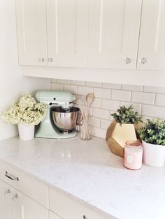 a kitchen with white cabinets and gold knobs on the front of the cabinet, is featured in american hardware jewelry for your kitchen cabinets