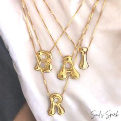 Elevate your summer style with our Bubble Letter Necklace, a stunning gold-plated monogram piece that combines fun and elegance. This balloon initial pendant is perfect for adding a personal touch to any outfit, whether you're hitting the beach or enjoying a night out. Crafted to be waterproof, this necklace is as durable as it is stylish, making it an ideal accessory for all your summer adventures. Unique Design: Features a charming bubble letter pendant that adds a playful yet sophisticated touch to your look. Gold Plated: Made with high-quality gold plating, ensuring durability and a brilliant shine that lasts. Waterproof: Designed to withstand summer activities, from beach days to pool parties, without losing its luster. Perfect Gift for Her: Whether it's for a birthday, anniversary, g Gold Monogram Necklace In Trendy Style, Trendy Customizable Gold Necklaces, Trendy Gold Monogram Necklace, Gold Trendy Initial Necklace, Trendy Gold Initial Necklace For Personalized Gift, Trendy Personalized Gold Initial Necklace, Trendy Gold Initial Necklace, Trendy Gold Monogram Jewelry, Trendy Gold Jewelry With Monogram