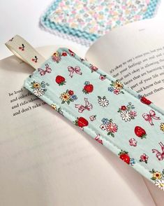 a bookmark is laying on top of an open book