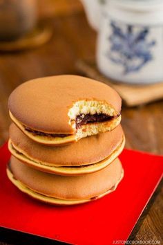 a stack of cookies sitting on top of a red plate