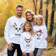 Get your family into the festive spirit with our Matching Christmas Family Shirt. This adorable set features a personalized name Christmas Reindeer design, perfect for adding a touch of holiday magic to your family's wardrobe. These Cute Matching Xmas Shirts are ideal for family gatherings, holiday events, or for capturing memorable Christmas photos. Each shirt can be customized with individual names, making them not only a fun holiday outfit but also a cherished keepsake. Whether you're celebrating at home or heading out for festive fun, these shirts are sure to bring smiles and a sense of togetherness.  🌟 Cyber Monday Special! Enjoy up to 40% off on all t-shirts. Hurry, offer lasts for only 36 hours!  About Our Tees: 🌈 At CrownBubble, we believe that a t-shirt is more than just a piece Family Matching Winter Tops For Gifts, Family Matching White Holiday Tops, White Family Matching Holiday Tops, Family Matching White Tops For Holiday, White Family Matching Tops For Holidays, Family Matching White Christmas Tops, Family Matching White Tops For Christmas, Casual Customizable Christmas Tops, Personalized White Tops For Winter