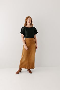 A well-loved denim skirt now in camel! Simple lines, classic, and comfortable, the 'Sara' is everything a denim skirt should be! This timeless long denim skirt is made from a soft, stretch denim that falls straight from the hips to ensure a modest and flattering fit. Featuring a wide waistband for extra comfort and ease of styling. Wear the 'Sara' comfortably from day to night with your favorite cozy sweater or a simple tee! 97% Cotton 3% Spandex Machine Wash Cold Do Not Bleach Hang to Dry Low I Everyday Fall Lined Skirt, Lined Denim Skirt For Workwear In Fall, Fall Workwear Denim Skirt With Lining, Fall Workwear Lined Denim Skirt, Casual Brown Midi Pencil Skirt, Stretch Denim Skirt, Long Denim Skirt, Simple Tees, Flutter Sleeve Top