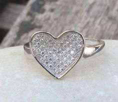 A lovely heart ring adorned with pave set crystals, makes a sweet gift. Wrapped in a box ready for gift giving.(r48) Heart measure 10mm x 13mm. *LIKE* us on Facebook http://www.facebook.com/Belesas to get 10%off coupon code, *FOLLOW* us on Twitter https://twitter.com/#!/Belesas to get more exclusive coupon codes *All item are ready to ship! Free shipping on orders over $150 using coupon code BELESAS150 ---------------------------------------------------- ENTER MY SHOP ► http://www.etsy.com/shop/ Heart-shaped Diamond Ring With Accents For Valentine's Day, Heart-shaped Diamond White Diamond Ring For Valentine's Day, Diamond White Rings For Valentine's Day Gift, Valentine's Day Heart Cut Diamond Ring With Pave Setting, Cubic Zirconia Heart Ring For Mother's Day Gift, Valentine's Day Promise Ring With Pave Setting, Mother's Day Gift Heart Ring With Cubic Zirconia, Mother's Day Gift Cubic Zirconia Heart Ring, Silver Heart Cut Ring For Anniversary Gift