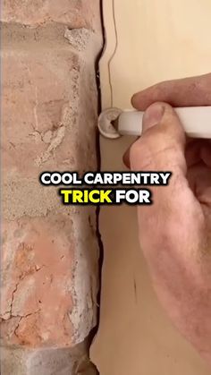 a man is fixing a brick wall with a screwdriver in his hand and the words cool carpentry trick for