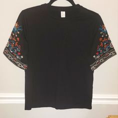 Nwot Women's Black Top W/ Embroidered Boho Bell Half Sleeve, Size Small I Ordered 2 By Mistake Super Cute, Always Get Compliments On This Top! Loose Fit, Perfect For A Night Out Or The Office! Black Embroidered Crew Neck Top, Black Embroidered T-shirt For Summer, Fitted Black Embroidered T-shirt, Casual Black Top With Embroidered Hem, Black Floral Embroidery Crew Neck T-shirt, Black Embroidered Summer T-shirt, Black Embroidered T-shirt For Spring, Black Short Sleeve Top With Floral Embroidery, Embroidered Black T-shirt For Spring