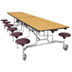 a long table with six stools on each side and a wooden top over it