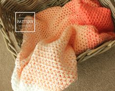 two crocheted blankets in a basket on the floor