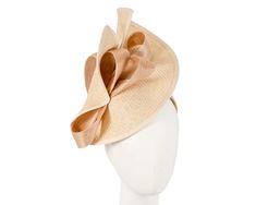 Large nude twisted plate decorated with silk abaca bow. Hand made in Melbourne by our skillful milliners, this headpiece will be a crown jewel of your spring racing outfit.   Made in Australia  Exclusive materials  Stylish design by Fillies Collection  Comfortable headband Elegant Beige Headpieces For Spring, Elegant Cream Headband For Spring, Chic Cream Adjustable Headpiece, Chic Adjustable Cream Headpieces, Elegant Beige Hair Accessories For Spring, Elegant Fitted Fascinator With Ribbon, Beige Headband For Spring Party, Elegant Spring Hair Accessories With Decorative Bow, Elegant Beige Headpiece For Formal Occasions