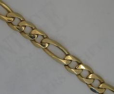 14 karat yellow gold heavy solid figaro link chain bracelet. The estate bracelet is 10.3 mm in width and is 8.5 inches in length and is secured with an integrated box catch with figure 8 safety clasp. Formal Figaro Chain Link Bracelet, Formal Figaro Chain Bracelet With Oval Link, Formal Gold Figaro Chain Bracelet, Yellow Gold Figaro Chain Bracelet With Rectangular Links, 14k Gold Cuban Link Figaro Chain Bracelet, Classic Gold Bracelet With Figaro Oval Link, Classic Gold Figaro Chain Bracelet, Classic Figaro Chain Gold Bracelet, Classic Gold Bracelet With Figaro Chain