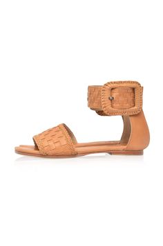 These leather sandals are made to order from high quality soft leather. Delight in the craftsmanship of these jaw dropping Madagascar leather sandals. Featuring woven leather upper with braided accents and large decorative leather bound buckle these sandals will keep you sleek and chic anywhere you go. Style them with your mini wrap dress to elevate your everyday casual look or with your floaty maxi skirt for a super chic style. -Smooth leather lining and insole with embossed logo -Lightly padde Woven Leather Ankle Strap Sandals, Natural Woven Leather Flat Sandals, Bohemian Woven Leather Beach Sandals, Bohemian Woven Leather Sandals For Beach, Bohemian Sandals With Buckle Closure And Adjustable Fit, Bohemian Woven Leather Huarache Sandals For Summer, Brown Leather Woven Sandals, Bohemian Natural Woven Leather Huarache Sandals, Adjustable Woven Leather Closed Toe Sandals