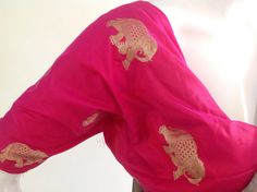 "Gorgeous royal blue and pink semi silk saree with intricate elephant hand embroidery and silk brocade unstiched blouse in pink with matching elephant weave. The hot pink color of the blouse is simply stunning when paired with royal blue of the saree. Beautiful elephant zardosi work makes this a stunning piece. Saree length 5.5 meters Blouse fabric 1 meter 44\" wide Saree ships in 2-3 days of payment.Shipping time is 4-5 days with tracking. We also offer blouse and petticoat stitching for saree Pink Paithani Silk Traditional Wear With Resham Embroidery, Pink Paithani Silk Blouse Piece With Zari Work, Pink Blouse Piece With Motifs For Diwali, Pink Raw Silk Blouse Piece With Motifs, Pink Chanderi Blouse Piece With Motifs, Pink Blouse Piece In Raw Silk With Motifs, Pink Unstitched Blouse Piece With Motifs, Pink Silk Traditional Wear With Motifs, Unstitched Pink Blouse Piece With Motifs