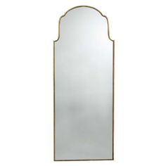 a tall mirror with an arched frame