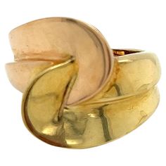 Vintage 1980's 18k Yellow And Rose Gold Wide Bypass Statement Ring. The design on the top measures 18mm long and 12mm wide and sits 8mm high off the finger. The band on the side measures 10mm wide and tapers down to 5mm wide on the bottom. The finger size is 6.5 and it can be sized upon request. The ring weighs 11.88g and is stamped 18K. Yellow Roses, Statement Ring, Fashion Rings, Statement Rings, Jewelry Rings, Rose Gold, Band, Ring, Yellow