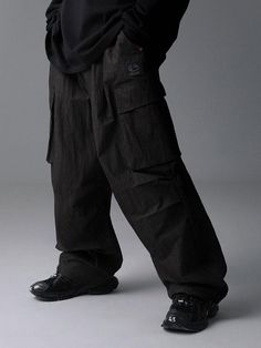 These casual wide pants are designed with multiple pockets and signature 3M logo print. They're made from light and sturdy cotton-nylon blend.- Elasticated waistband with inside drawstring  - Two front slash pockets- Two side cargo pockets- Two back patch pockets- Double knee tucks- Signature lettering logo 3M print- Adjustable drawcord at hem- Logo-engraved stopper - Wide balloon fit - Unisex wear Streetwear Wide-leg Pants With Hip Pockets, Urban Wide-leg Pants With Pockets, Black Cargo Jeans With Patch Pockets For Outdoor, Streetwear Full-length Parachute Pants With Patch Pockets, Streetwear Full Length Parachute Pants With Patch Pockets, Streetwear Cargo Pants With Relaxed Fit And Hip Pockets, Urban Wide Leg Parachute Pants With Patch Pockets, Urban Wide-leg Parachute Pants With Patch Pockets, Sporty Streetwear Cargo Pants With Patch Pockets