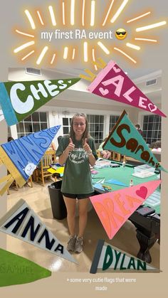 a woman standing in front of a table with lots of kites on it