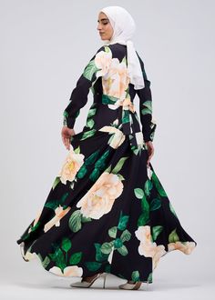 Elevate your wardrobe with this stunning floral print button-front maxi dress, crafted from durable crepe fabric for long-lasting comfort and elegance. The soft black base is adorned with a vibrant floral pattern, making it a standout piece for any occasion. Designed with a modest fit, this dress features a belted waist and tiered skirt, providing a flattering silhouette that flows gracefully with every movement. The button-front design adds a touch of sophistication, while the long sleeves ensu Button Front Maxi Dress, Modest Fits, Abaya Dress, Button Front Dress, Floral Print Maxi Dress, Floral Print Maxi, Dress Satin, Button Dress, Crepe Fabric