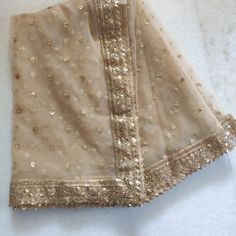 Golden Indian Dupatta party wear | Long net embroidered scarf | Punjabi dress dupattas with zari embroidery for lehenga | Dupatta This Dupatta is sequin embroidered on net with beautiful golden border. This can be your wedding dress chunni for Indian occasion wear for festival. This has perfect bling for you to look classy and ethnic at same time. This can even be your home decoration fabric for you can even wear them with lehenga. This can be made in any color. We can even make a jacket or ponc Cheap Chanderi Dupatta For Festivals, Luxury Net Dupatta With Traditional Drape, Luxury Slub Silk Dupatta With Embroidered Border, Luxury Dupatta With Dabka Work For Festivals, Luxury Cream Dupatta With Chikankari Embroidery, Luxury Chikankari Embroidery Dupatta For Wedding, Luxury Chinon Dupatta With Handwork, Luxury Dupatta With Dabka Work On Net, Luxury Gold Dupatta With Chikankari Embroidery