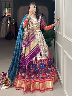 This stunning white & purple gaji silk lehenga is adorned with intricate digital print and lagadi patta work. Paired elegantly with a matching gaji silk choli featuring identical digital print and lagadi patta work, and complemented by a striking blue gaji silk dupatta embellished with digital print work and lagdipatta work, complete with tassels on both sides, this ensemble exudes sophistication and charm.
The combination of white and purple hues, combined with the intricate digital print a Gaji Silk Dupatta, Engagement Gown, Lehenga Crop Top, Silk Lehenga Choli, Lehenga Choli Wedding, Floral Lehenga, Party Wear Lehenga Choli, Reception Gown, Bollywood Lehenga