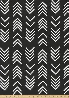 black and white chevroned fabric with an arrow pattern