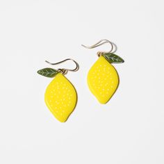 Lemon Earrings from WOLL Jewelry. Our collection of fruit earrings are made in San Francisco, California. Pear-shaped Earrings For Gifts, Pear-shaped Pierced Earrings For Gift, Single Pear Shaped Earring As Gift, Pear-shaped Single Earring As Gift, Yellow Fruit Design Earrings As Gift, Yellow Fruit Design Earrings Gift, Yellow Fruit Design Earrings For Gift, Gold Fruit Design Drop Earrings, Gold Drop Earrings With Fruit Design