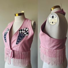 "Handmade bubblegum pink denim halter crop top made from an original pattern. This top features a denim button closure at the waist and around the neck. The neck and waist are size adjustable by an inch. Custom appliqué design on the front. I will be making more of these to come, but please feel free to message me for a custom as I do have more of this pink denim available. Measurements for this top are as follows: Bust 34-36\" Waist 28-31\" Length from side 7\"" Pink Cropped Cotton Crop Top, Trendy Cropped Cotton Denim Vest, Summer Cotton Denim Crop Top, Spring Cotton Denim Crop Top, Cropped Cotton Denim Vest For Summer, Sleeveless Pink Crop Top For Festival, Pink Cropped Halter Top For Spring, Fitted Cotton Denim Vest For Summer, Fitted Pink Denim Top