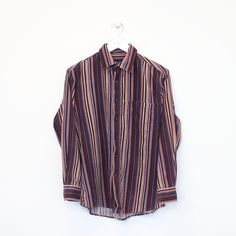 SKU - CR26569 Vintage Heilan Hame striped chord shirt in multiple colours. Best fits S DETAILS: ▫️ Full button up  ▫️ Front pocket   👕 Fits like a ~ S ▫️ Label states ~ S ▫️ Pit to Pit ~ 21" ▫️ Length ~ 28" ▫️ Pit to Cuff ~ 17.5"   👇 If any defect is found and it is not included in the provided photos, it will be listed below. ▫️     🧺 All items are professionally washed and ironed before photos are taken and then sold.    ✅ If the item is listed, it is available    ❌ Disclaimer: Like all vin Striped Collared Shirt For Fall, Fall Striped Collared Shirt, Fall Button-up Shirt With Vertical Stripes, Fall Striped Button-up Shirt, Striped Yarn-dyed Button-up Shirt, Yarn-dyed Striped Button-up Shirt, Yarn-dyed Striped Collared Shirt, Multicolor Button-up Top With Striped Collar, Retro Striped Button-up Shirt