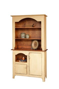 an old fashioned wooden hutch with two doors and cupboards on the top shelf