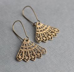 These intricate and beautiful earrings feature a bohemian filigree design in solid brass, which has an aged finish with touches of deep gold.  The beautiful, intricate detail reminds us of vintage lace. The earwires are solid brass, and these earrings are available in two length options.   ★ MEDIUM (3.5cm) fan hangs an inch below the earlobe ★ LONG (5cm) fan will hang at jawline level. This piece of handmade jewellery comes packaged in a nice recycled gift box with a handmade tag, all ready to g Bohemian Bridal Earrings With Intricate Design, Party Brass Filigree Earrings, Bohemian Pierced Chandelier Earrings For Wedding, Bohemian Nickel-free Chandelier Earrings For Weddings, Bohemian Drop Bridal Earrings Gift, Bohemian Bridal Drop Earrings Gift, Bohemian Bridal Drop Earrings, Delicate Brass Earrings, Handmade Art Deco Earrings For Weddings