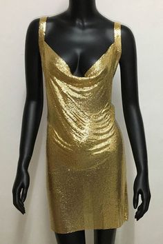 As a product expert, I present to you the stunning Halter Silver Gold Sequined Homecoming Dresses. These dresses feature a halter neckline and are adorned with silver and gold sequins, making them perfect for any special occasion. The sequins add a touch of glamour and will surely make the wearer stand out in a crowd. Elevate your wardrobe with these beautiful and sophisticated dresses. Details: Dress Style: A-Line Color: Silver, Gold Neckline: V-Neck Sleeves: Sleeveless Back Style: Zipper Elegant Gold Sleeveless Sequin Dress, Glamorous Gold Dress With Contrast Sequin, Gold Party Dress With Contrast Sequin, Gold Sequin Summer Party Dress, Gold Sequin Dress For Summer Night Out, Gold Sequin Fabric For Party Season, Gold Sleeveless Sequin Fabric For Party Season, Gold Halter Neck Mini Dress For Party Season, Gold Sequin Dress For Summer