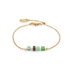 Enjoy the simple elegance of our Mini Cubes & Chain bracelet in gold-green - a sophisticated piece of jewellery that enchants with its delicate design and the unique charm of the materials. This piece of jewellery combines the timeless beauty of real stone cubes such as green aventurine with the dazzling brilliance of Swarovski crystals. The innovative sliding clasp ensures a customised fit and allows you to adjust the length of the bracelet to your liking, ensuring optimum wearing comfort. Emerald Jewelry With Adjustable Green Chain, Green Emerald Jewelry With Adjustable Chain, Elegant Green Jewelry With Gold Chain, Green Minimalist Bracelet With Jubilee Design, Green Metal Chain Jewelry, Luxury Green Chain Jewelry, Gold Bracelets For May Birthstone, Green Gold-plated Jewelry With Adjustable Chain, Yellow Gold Plated Crystal Jubilee Bracelet