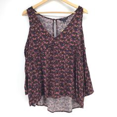 American Eagle Floral V-Neck Cold Shoulder Top Women's Size Medium Condition: New With Tags Material: 100% Viscose Lightweight Woven Fabric Off-The-Shoulder V-Neckline Ruffle Trim Cinched Sleeve Cuffs Back Keyhole Detail Relaxed Fit Measurements Available Upon Request No Trades/Holds Offers Welcome! Purple V-neck Beach Top, Casual Purple Tank Top With Floral Print, Multicolor V-neck Tank Top, Purple V-neck Top For Summer, Casual Purple V-neck Blouse, Purple V-neck Top For Vacation, Bohemian Purple V-neck Tops, Purple V-neck Blouse For Summer, Three Quarter Sleeve Shirt