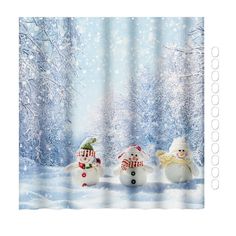 three snowmen standing in front of a snowy forest with trees and blue sky behind them