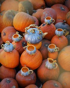 a pile of pumpkins sitting next to each other