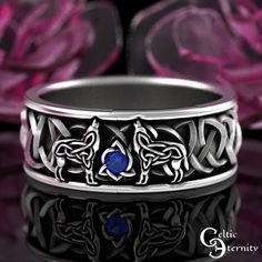 See this ring with more stones and metals: www.etsy.com/shop/CelticEternity?search_query=1170 Band Height 7.4mm Stones: 1x 2mm Sapphire Two intricate Celtic wolves join voices over a sparkling gemstone. The silhouette is created with Celtic knots and blends seamlessly with the traditional Celtic knots that surround it. The wolf is a symbol of guardianship, ritual, loyalty, and spirit. Wolf has the ability to make quick and firm emotional attachments, and can trust their own instincts. Every ring is handmade to order and in YOUR CUSTOM size; we do not keep backstock. Please buy our refundable ring sizer (BEFORE ORDERING) as most rings cannot be resized because of the continuous knotwork: www.etsy.com/listing/937178260 About This Item: Cast in solid 925 sterling silver (nickel-free), these r Mens Wolf Ring, Wolf Engagement Ring, Mens Eternity Wedding Bands, Western Engagement Rings, Wolf Wedding, Eternity Engagement Band, Celtic Wolf, Spirit Wolf, Wedding Band Silver