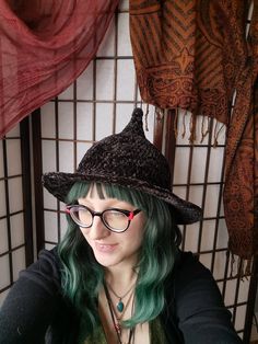 This velvety soft witchy hat with a small nubbin point is the perfect understated accessory for special events or everyday wear! The brim is crocheted around a wire making it bendy and adjustable to the shape you like. There is some stretch to this hat (like a toque) so it will fit a variety of head sizes, though it might be a little tight on an xxl hat size (measurements below). Pictured on a small/medium hat sized model. This kind of yarn will relax a bit with wear, so the hat may become flopp Flat Brim Halloween Hat, Fitted Flat Brim Hat For Halloween, Fitted Brimmed Halloween Hat, Fitted Brimmed Hat For Halloween, Witchy Hat With Curved Brim For Winter, Witchy Winter Hat With Curved Brim, Witchy Curved Brim Winter Hat, Adjustable Crochet Hat With Short Brim For Fall, Witchy Costume Hats With Curved Brim For Fall